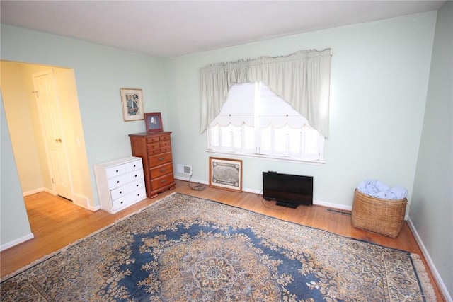 220 New Wickham Dr Unit 220, Penfield, NY 14526 - bedroom with wood finished floors and baseboards