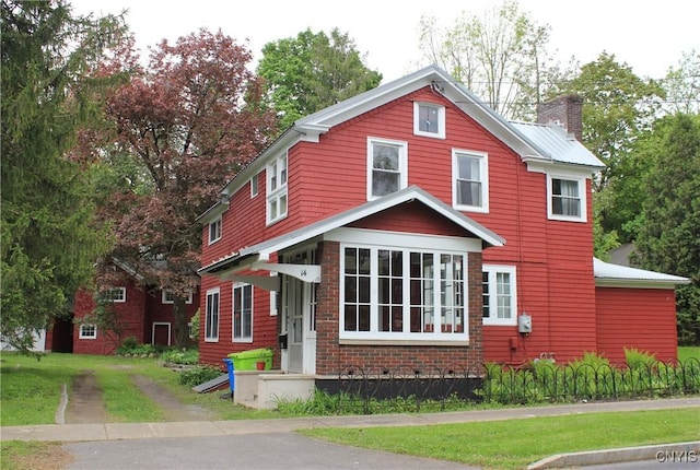 14 Fenner St, Cazenovia, NY 13035 - view of front facade featuring a chimney