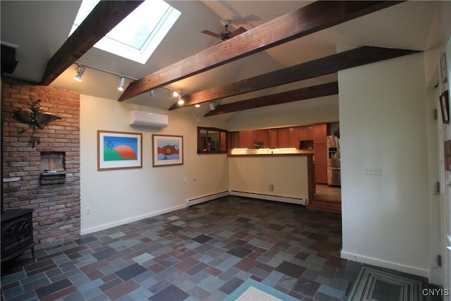 14 Fenner St, Cazenovia, NY 13035 - unfurnished living room with a skylight, a baseboard heating unit, baseboards, a wall mounted air conditioner, and a wood stove