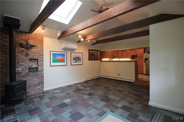 14 Fenner St, Cazenovia, NY 13035 - unfurnished living room with a wood stove, a wall mounted AC, a skylight, baseboards, and beam ceiling