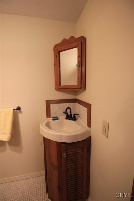 14 Fenner St, Cazenovia, NY 13035 - bathroom with vanity and baseboards