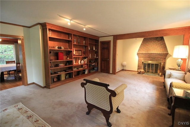 14 Fenner St, Cazenovia, NY 13035 - living area featuring baseboards, light carpet, a fireplace, and crown molding
