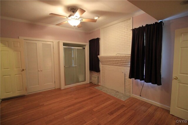 14 Fenner St, Cazenovia, NY 13035 - unfurnished bedroom with crown molding, wood finished floors, and ceiling fan