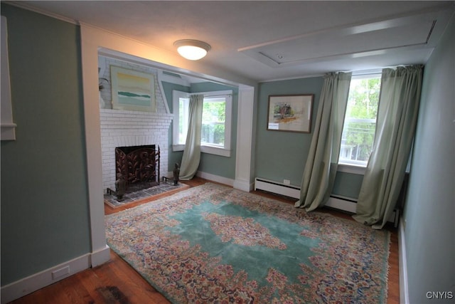 14 Fenner St, Cazenovia, NY 13035 - unfurnished living room with baseboards, attic access, a brick fireplace, and wood finished floors
