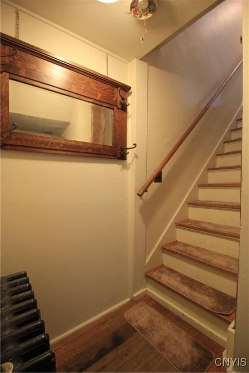 14 Fenner St, Cazenovia, NY 13035 - stairs featuring wood finished floors and baseboards