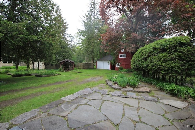 14 Fenner St, Cazenovia, NY 13035 - view of green lawn featuring a garage and an outbuilding