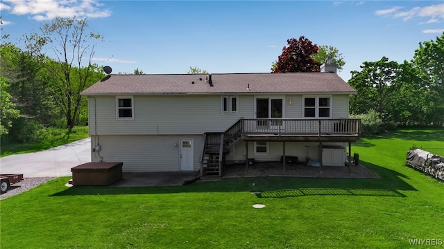591 Girdle Rd, Elma, NY 14052 - rear view of property with stairway, a deck, a patio area, a hot tub, and a chimney
