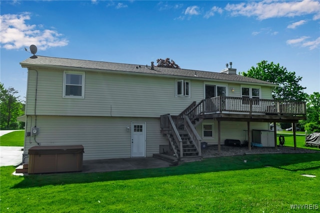 591 Girdle Rd, Elma, NY 14052 - back of property featuring a hot tub, stairs, a deck, a patio, and a chimney