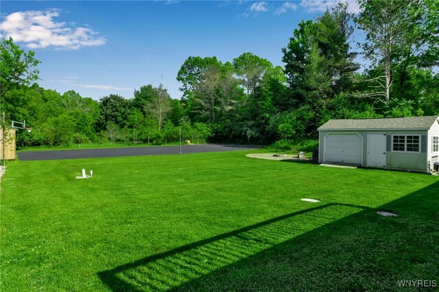 591 Girdle Rd, Elma, NY 14052 - view of green lawn featuring an outbuilding and a detached garage