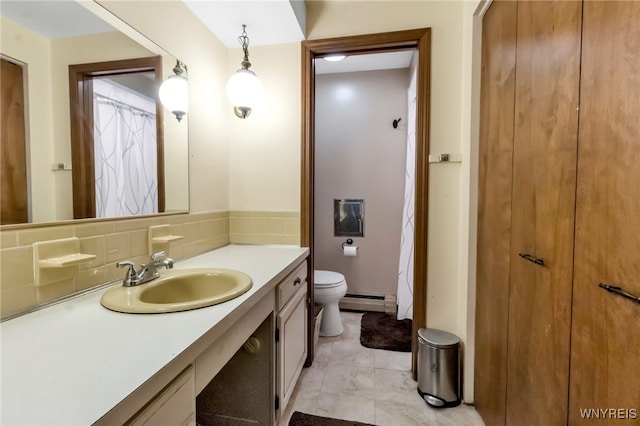 591 Girdle Rd, Elma, NY 14052 - bathroom featuring a baseboard radiator, toilet, vanity, and marble finish floors