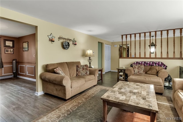591 Girdle Rd, Elma, NY 14052 - living room featuring wood finished floors, a baseboard radiator, and baseboards