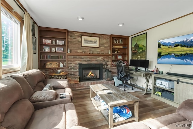 591 Girdle Rd, Elma, NY 14052 - living area featuring wood finished floors, a fireplace, built in features, and a desk