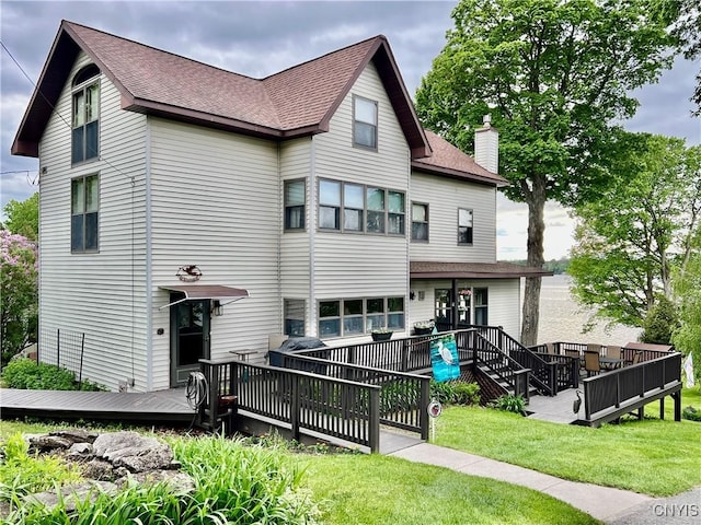9A Lina St, Morristown, NY 13669 - back of property with a wooden deck, a shingled roof, a chimney, and a yard
