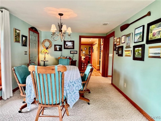 9A Lina St, Morristown, NY 13669 - carpeted dining room with a chandelier and baseboards