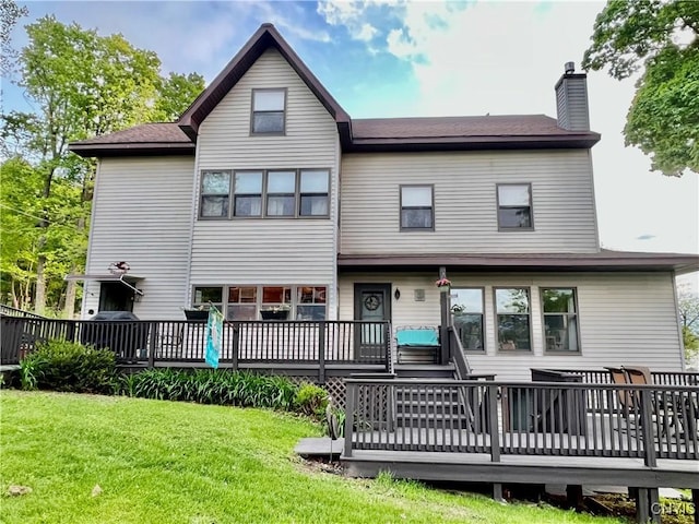 9A Lina St, Morristown, NY 13669 - back of property with a chimney, a wooden deck, and a lawn