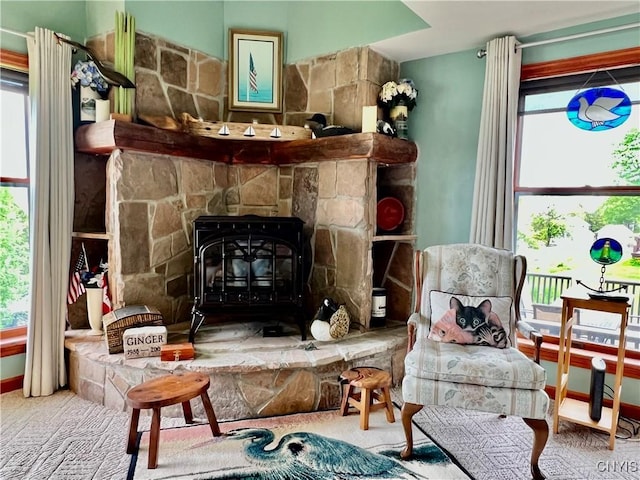 9A Lina St, Morristown, NY 13669 - living area with plenty of natural light and a wood stove