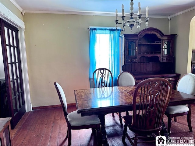 83 E Doughty St, Dunkirk-City, NY 14048 - dining area with wood-type flooring, a chandelier, baseboards, and ornamental molding