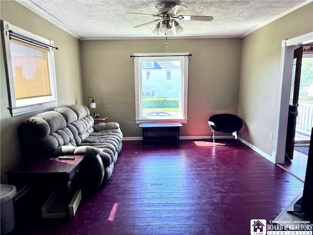 83 E Doughty St, Dunkirk-City, NY 14048 - living room featuring a textured ceiling, crown molding, hardwood / wood-style floors, ceiling fan, and baseboards