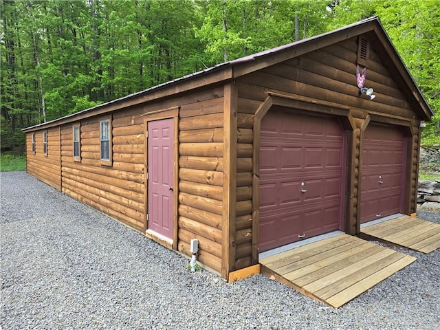 1311 Snake Creek Rd, Hancock, NY 13783 - detached garage with a view of trees