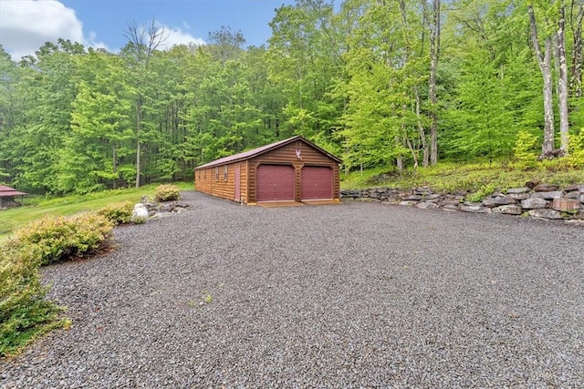 1311 Snake Creek Rd, Hancock, NY 13783 - detached garage with a forest view