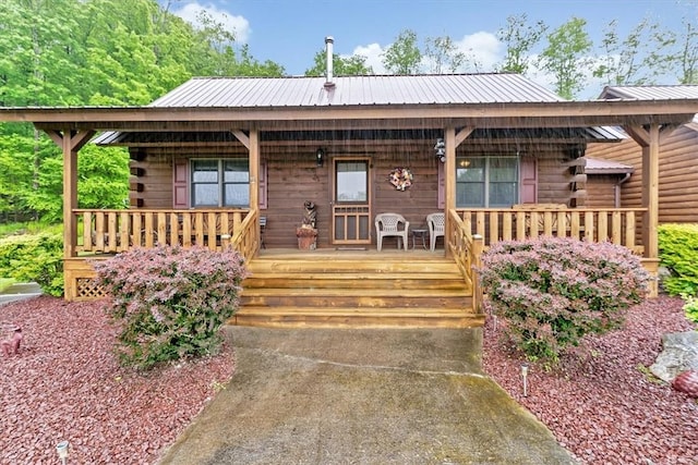 1311 Snake Creek Rd, Hancock, NY 13783 - log home featuring a porch and metal roof
