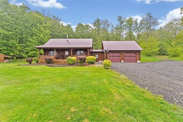 1311 Snake Creek Rd, Hancock, NY 13783 - log cabin featuring an attached garage, a front lawn, driveway, and a porch