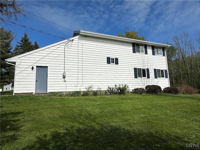 25 Highmore Dr, Oswego-Town, NY 13126 - view of side of property with a yard