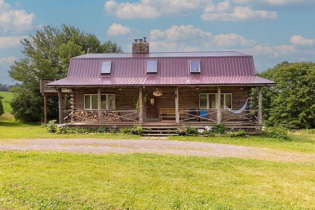 2165 Hamden Hill Rd, Hamden, NY 13782 - cabin featuring log exterior, metal roof, a chimney, and a front yard