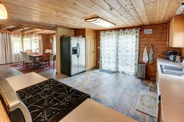 2165 Hamden Hill Rd, Hamden, NY 13782 - kitchen featuring stainless steel refrigerator with ice dispenser, wooden ceiling, a sink, a chandelier, and wooden walls