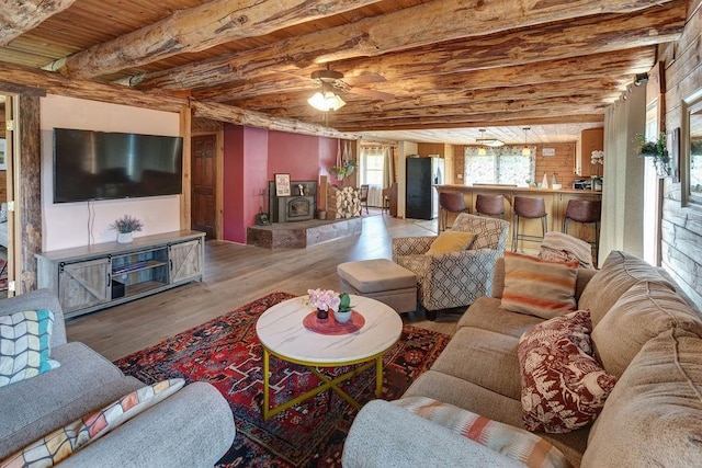 2165 Hamden Hill Rd, Hamden, NY 13782 - living room featuring wood finished floors, wooden ceiling with exposed beams, and a ceiling fan