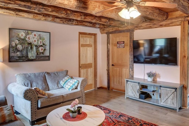 2165 Hamden Hill Rd, Hamden, NY 13782 - living area featuring wood finished floors, a ceiling fan, beamed ceiling, and baseboards