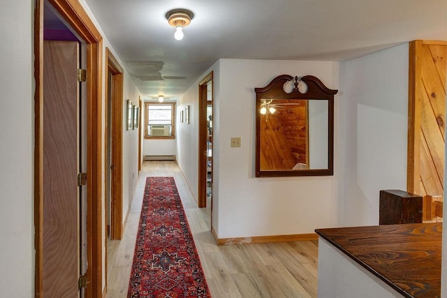 2165 Hamden Hill Rd, Hamden, NY 13782 - hall featuring light wood-style flooring, baseboards, a baseboard radiator, and cooling unit