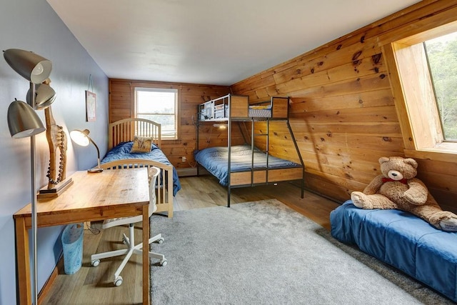 2165 Hamden Hill Rd, Hamden, NY 13782 - bedroom featuring wooden walls and wood finished floors