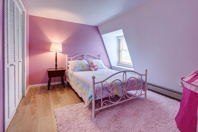 2165 Hamden Hill Rd, Hamden, NY 13782 - bedroom with a baseboard radiator, wood finished floors, and baseboards