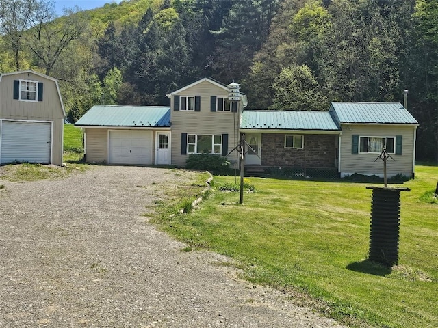 4636 Kirkwood Rd, Cohocton, NY 14826 - view of front facade featuring a front lawn, metal roof, driveway, and a forest view