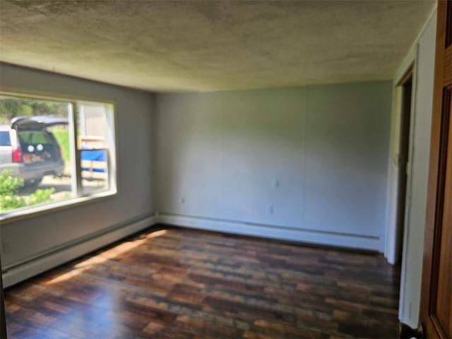 4636 Kirkwood Rd, Cohocton, NY 14826 - empty room featuring wood finished floors, a textured ceiling, and a baseboard heating unit