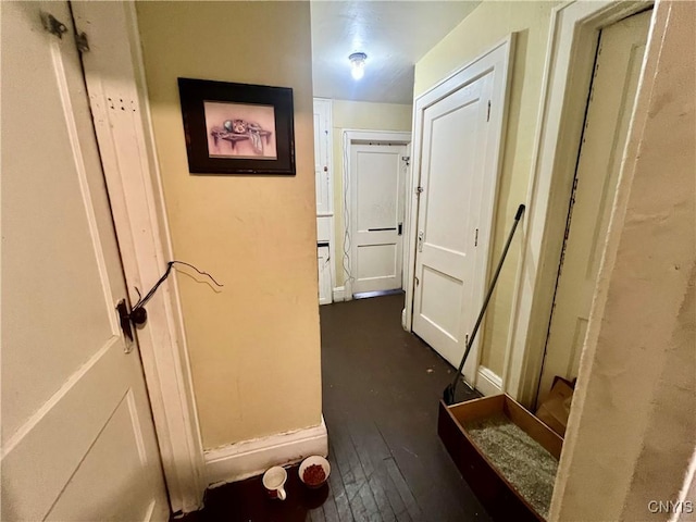 1703 Whitesboro St, Utica, NY 13502 - hallway featuring dark wood finished floors and baseboards
