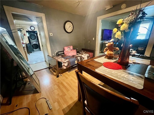 1703 Whitesboro St, Utica, NY 13502 - dining room with stacked washer / drying machine and wood finished floors