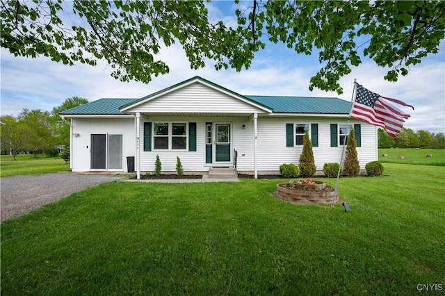 436 Centre St, Cape Vincent, NY 13618 - ranch-style house featuring metal roof, a front yard, driveway, and entry steps