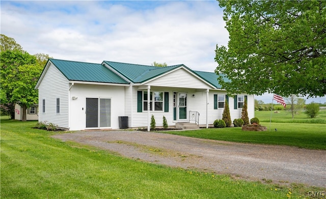 436 Centre St, Cape Vincent, NY 13618 - ranch-style house featuring driveway, a front yard, and metal roof