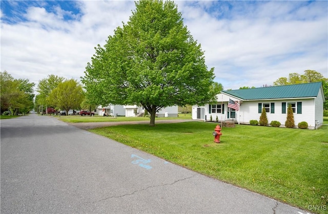 436 Centre St, Cape Vincent, NY 13618 - view of front of home with a front lawn and metal roof