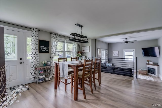 436 Centre St, Cape Vincent, NY 13618 - dining room featuring healthy amount of natural light, light wood-style floors, and ceiling fan