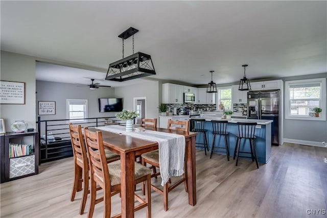 436 Centre St, Cape Vincent, NY 13618 - dining area featuring light wood finished floors, ceiling fan, and baseboards