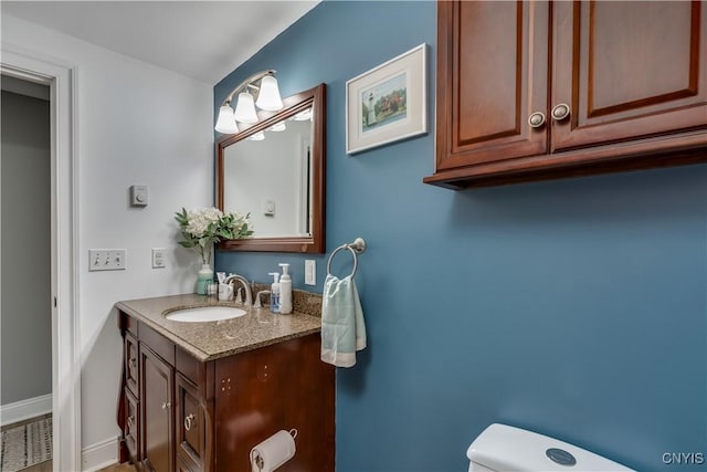 436 Centre St, Cape Vincent, NY 13618 - half bathroom featuring vanity, toilet, and baseboards