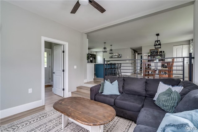 436 Centre St, Cape Vincent, NY 13618 - living area with a ceiling fan, light wood-style floors, and baseboards
