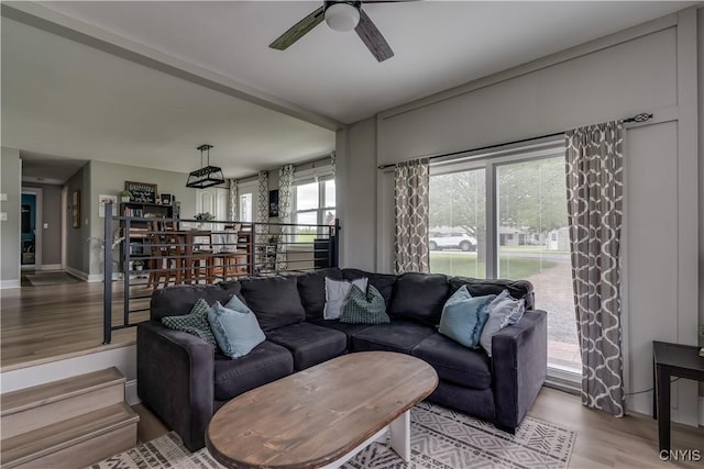 436 Centre St, Cape Vincent, NY 13618 - living area with light wood-style flooring, ceiling fan, and baseboards