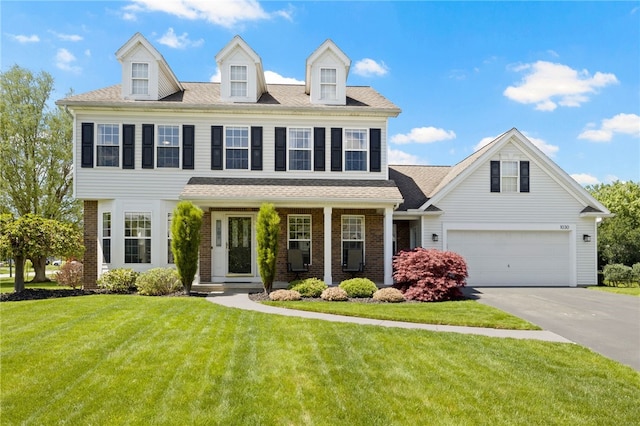 1030 Whistlers Cove Ln, Greece, NY 14612 - view of front of house featuring brick siding, concrete driveway, a front yard, and covered porch