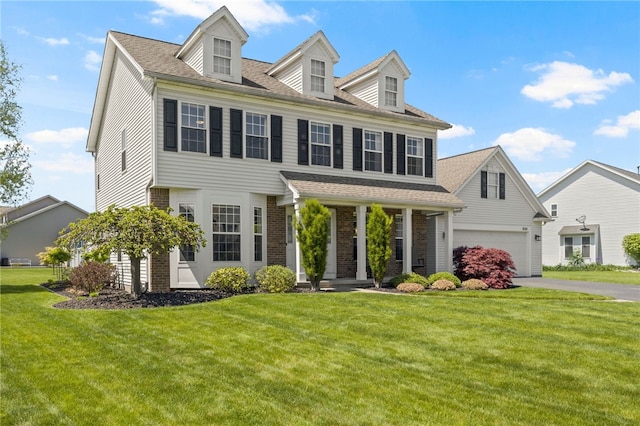 1030 Whistlers Cove Ln, Greece, NY 14612 - view of front facade featuring a front yard, brick siding, driveway, roof with shingles, and an attached garage