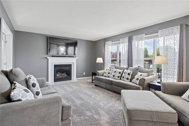 1030 Whistlers Cove Ln, Greece, NY 14612 - carpeted living area featuring a fireplace with flush hearth and baseboards