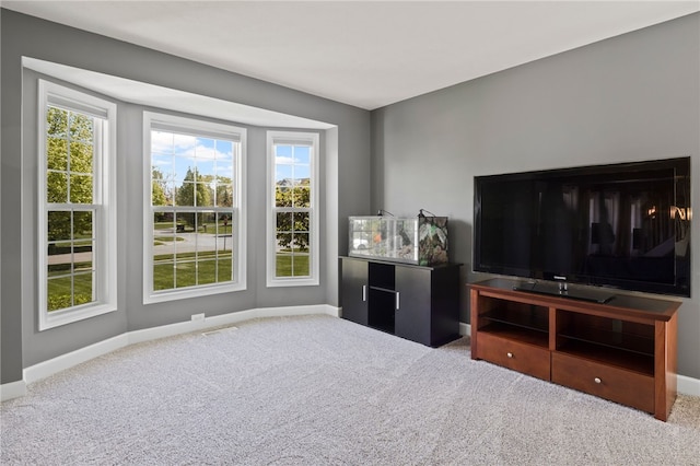 1030 Whistlers Cove Ln, Greece, NY 14612 - living room featuring carpet flooring, healthy amount of natural light, and baseboards